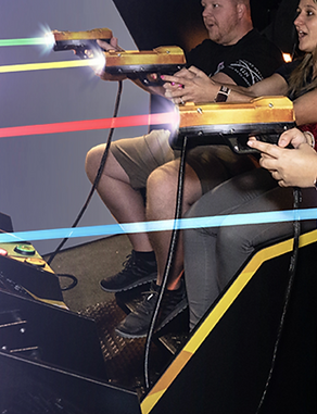 Friends enjoying Qube arcade game at Let's Play family entertainment center